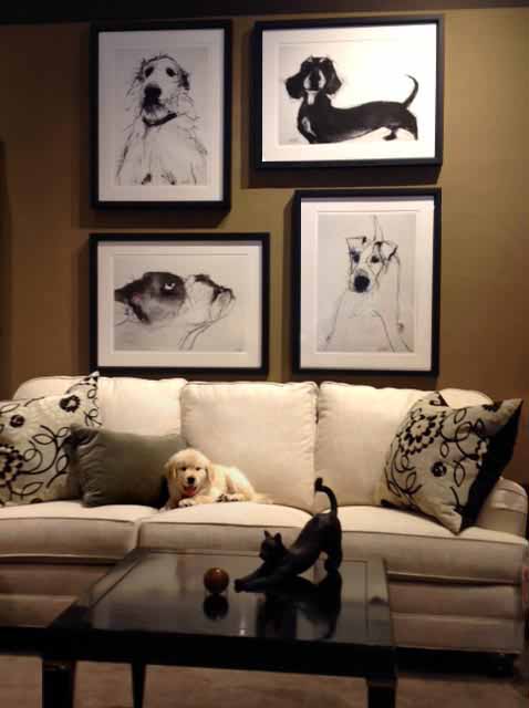 white fabric sofa with dog artwork