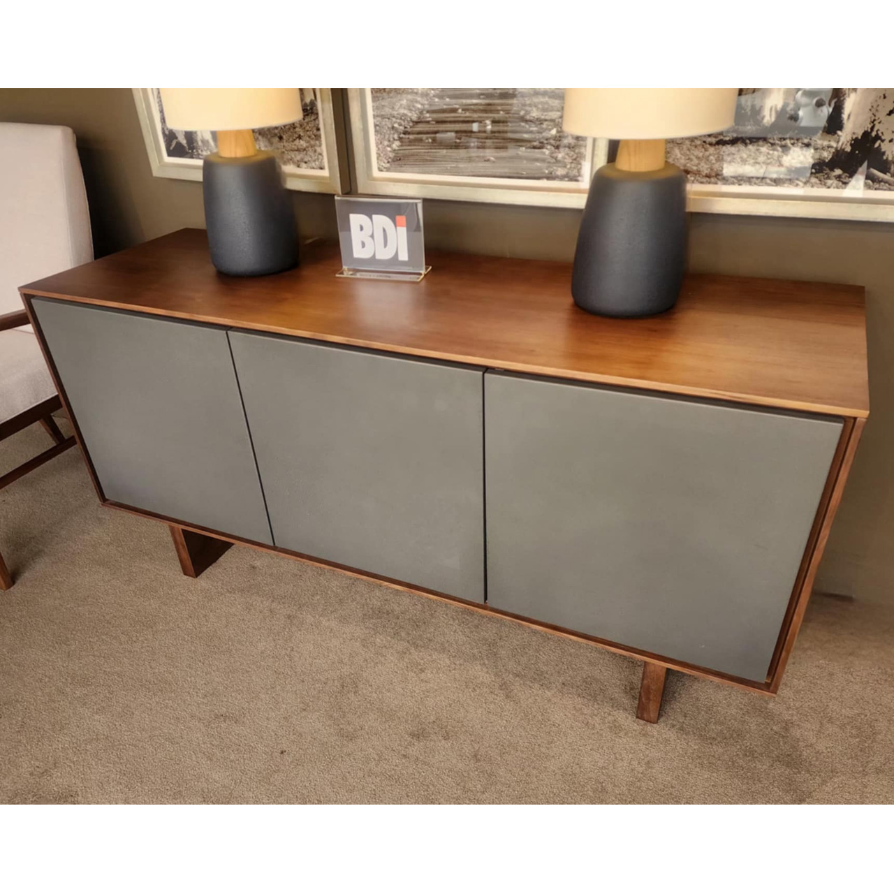 solid wood entertainment console with 3 grey metal doors