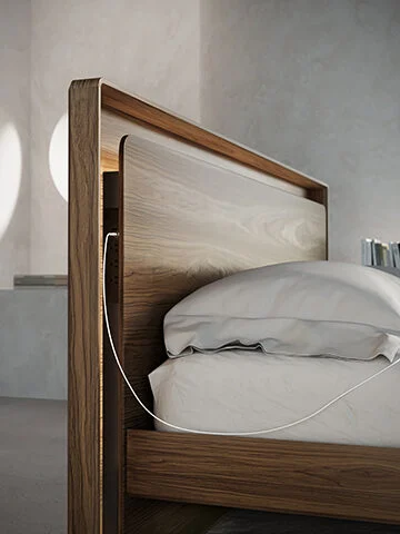 The height-adjustable Up-LINQ bed's innovative headboard features a floating front panel that conceals convenient charging for all devices and has three outlets and USB-A & USB-C ports on either side. A recessed shelf is ideal for stowing away your phone, lotions, or potions for the night and freeing up space on the nightstand. Rounded edges and recessed feet ensure late-night trips to the fridge don't result in stubbed toes or bruised shins.