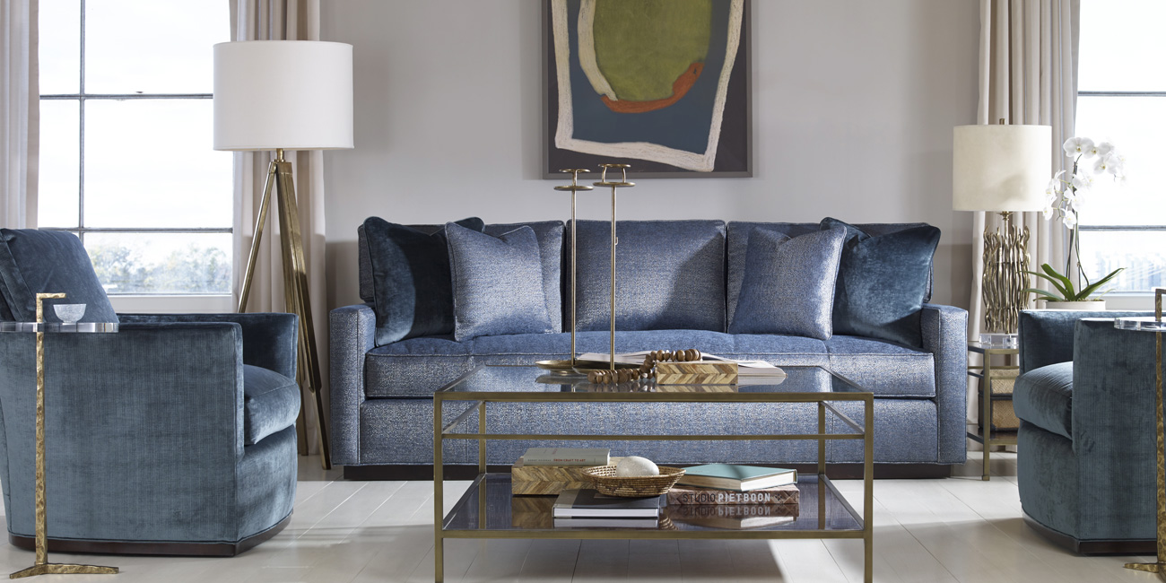 living room with blue sofa and chairs