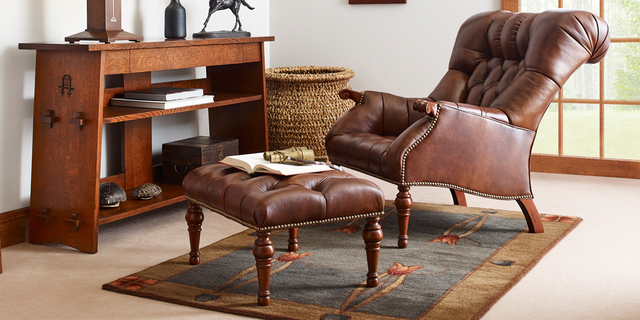 tufted leather chair and footstool