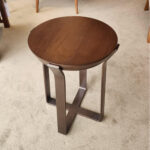 round wood top table with metal base